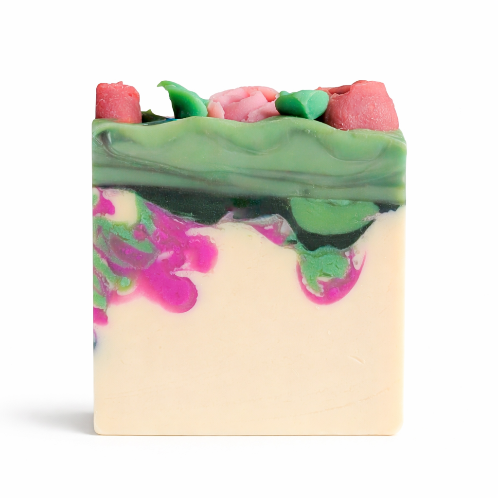 Colorful soap bar with pink and green floral designs on a white background