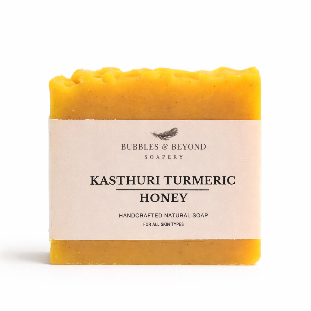 Bar of soap with 'Kasturi turmeric -Honey Bubbles & Beyond' label on a white background