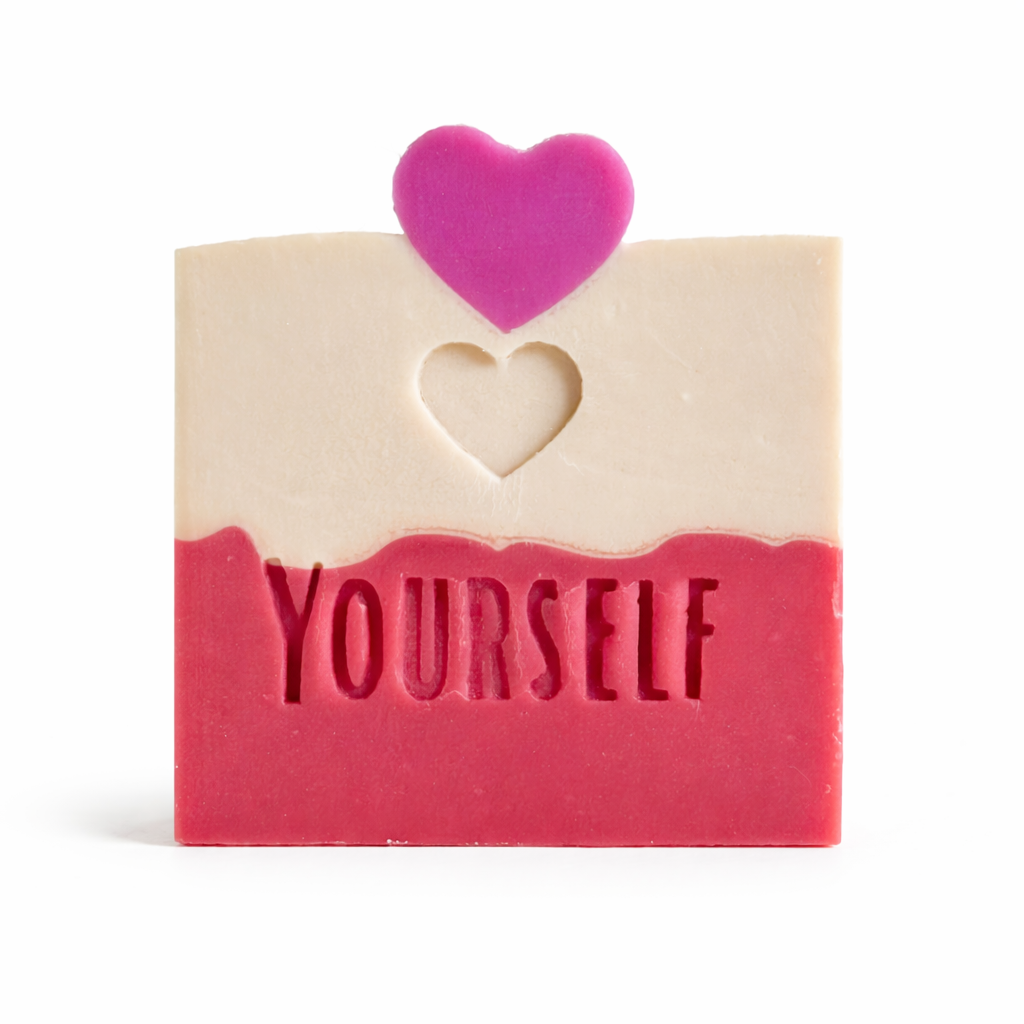 Bar of soap with a heart-shaped embedded and 'Love yourself' engrave on the surface