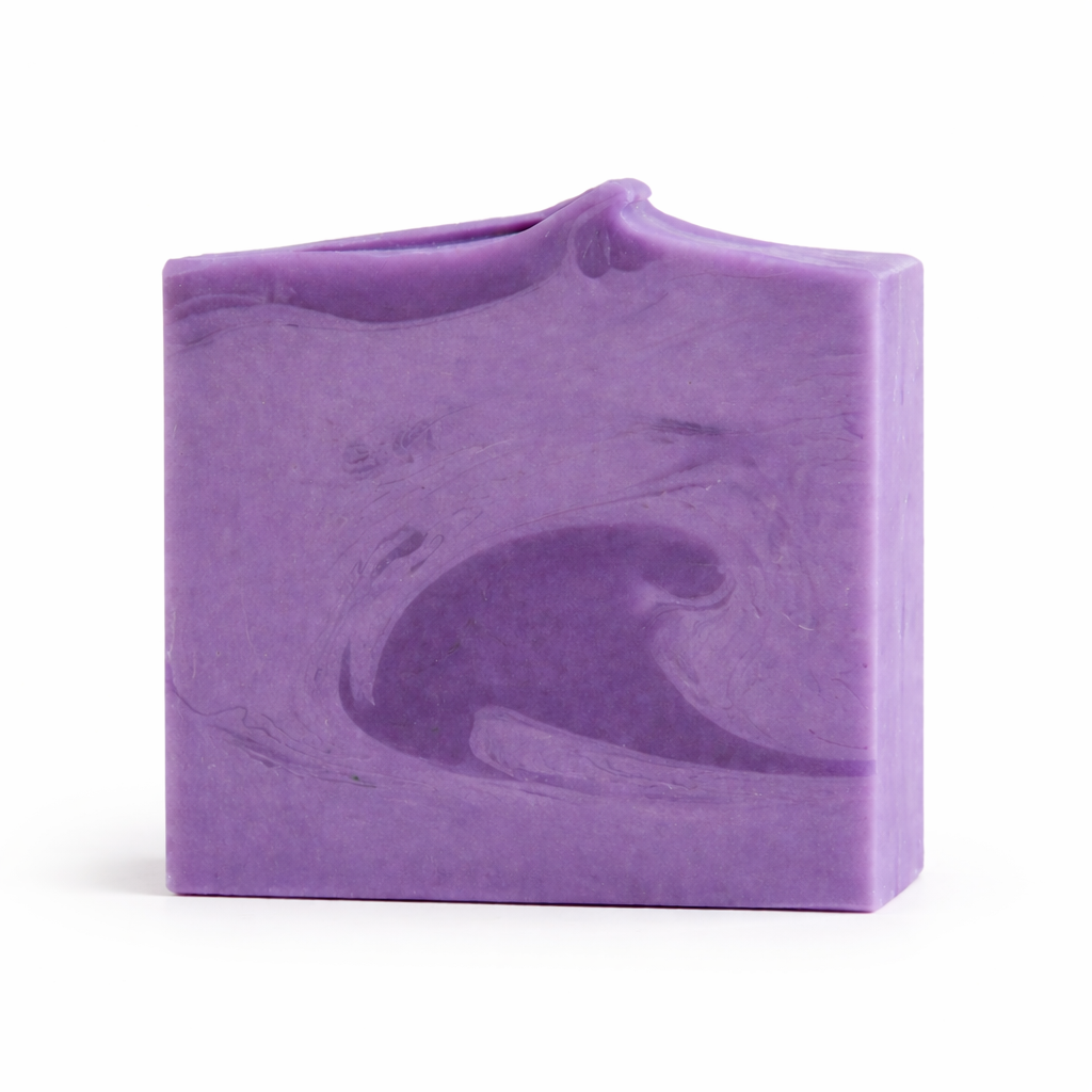Purple soap bar with a wavy texture on a white background